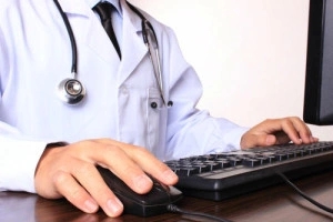 Doctor on computer